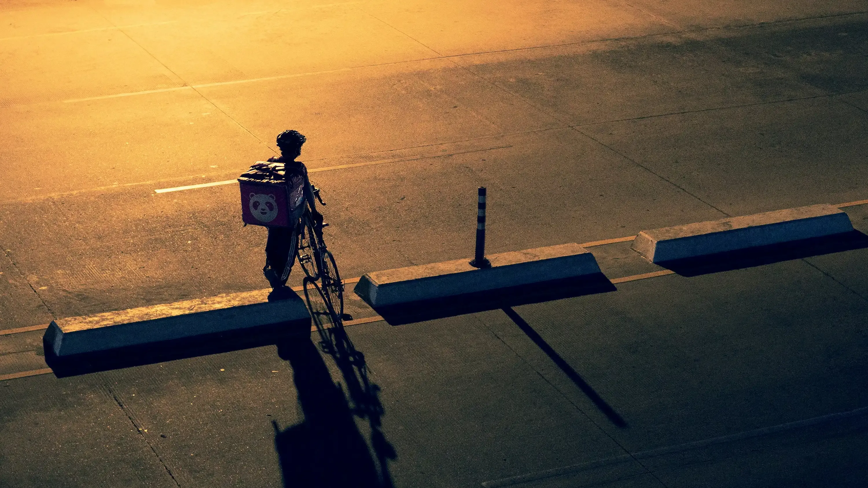 A foodpanda delivery person on a bicycle